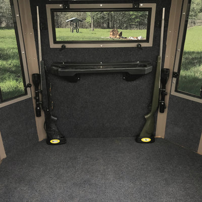 two rifles held in place with a CoJo gun magnet on the barrel and  each of the rifles are setting the butt of the guns in the cojo  Assperatus