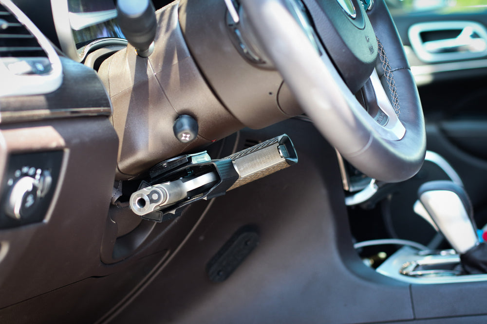 Universal magnetic holster mounted under the steering wheel