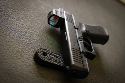 Pistol with Red Dot sight on a CoJo Gun Gripper gun magnet