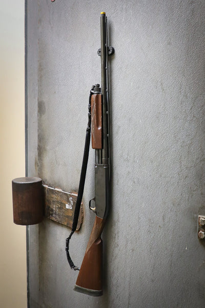 A Shotgun held to a safe door by a CoJo Gun gripper gun magnet